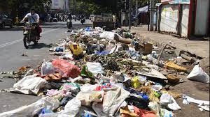 Piles of dirt and filth on the sides of various roads in Pulwama
